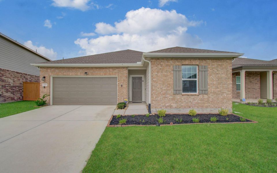 Front exterior of a new home in Sunterra, Katy, TX, highlighting curb appeal (Image 2). Front exterior of a new home in Sunterra, Katy, TX, highlighting curb appeal (Image 2).
