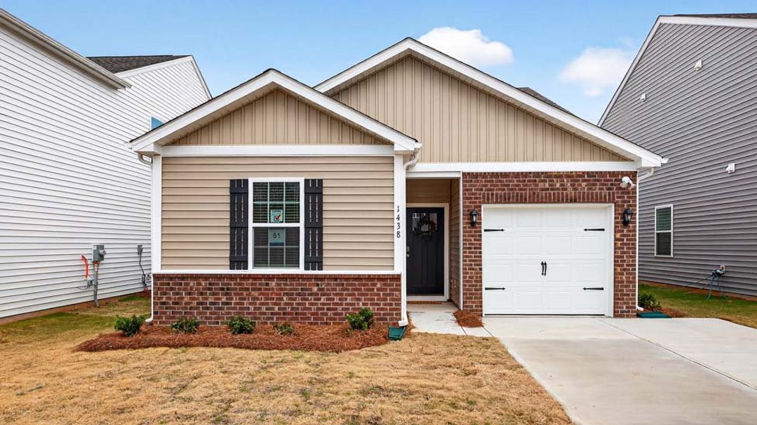 Front exterior of a new home in The Hamptons at Hickory, Hickory, NC, highlighting curb appeal (Image 1). Front exterior of a new home in The Hamptons at Hickory, Hickory, NC, highlighting curb appeal (Image 1).