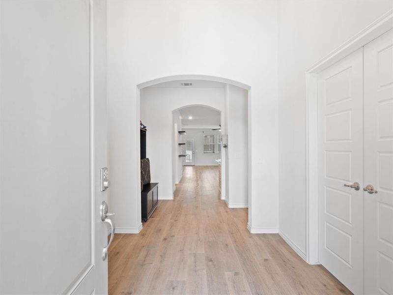 Hallway featuring light wood-type flooring