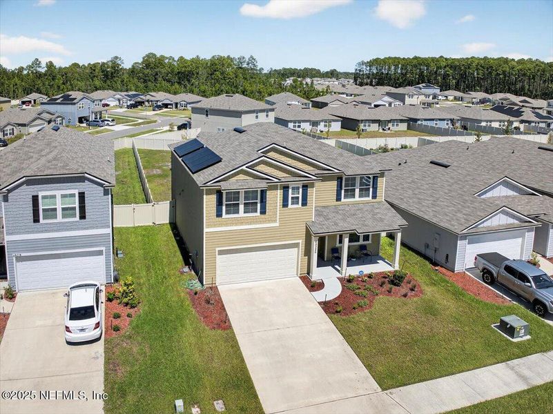 Front exterior of a new home in River Glen Express, Yulee, FL, highlighting curb appeal (Image 19).