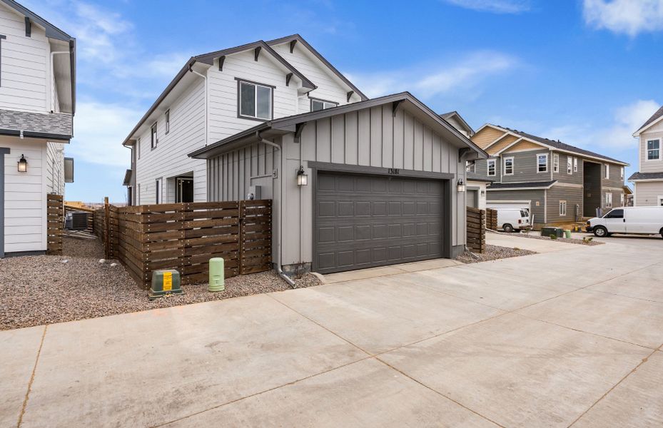 Front exterior of a new home in Barefoot Village, Firestone, CO, highlighting curb appeal (Image 2). Front exterior of a new home in Barefoot Village, Firestone, CO, highlighting curb appeal (Image 2).