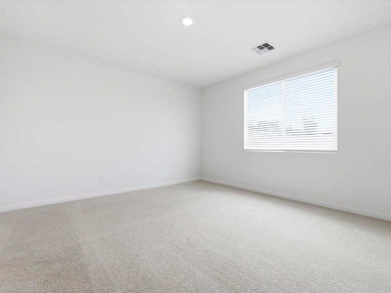 Spacious, unfurnished interior of a new home in White Tank Foothills Signature Series, Waddell (Image 14).