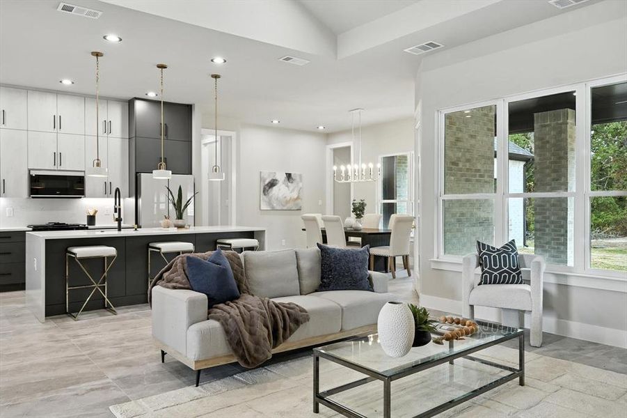 Living room with recessed lighting and a chandelier