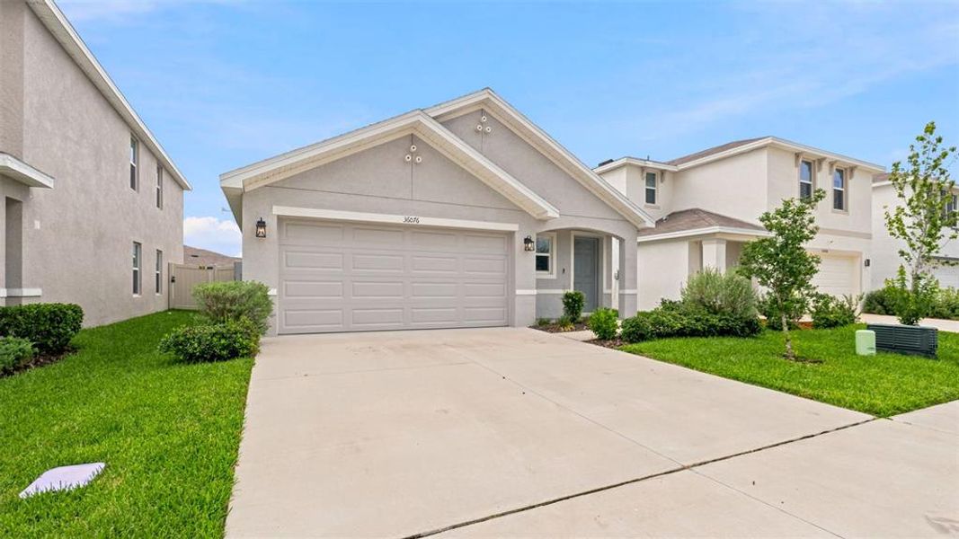 Front exterior of a new home in Northwater at Two Rivers, Zephyrhills, FL, highlighting curb appeal (Image 27).