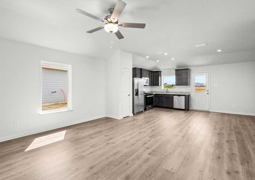 The open concept layout connects the kitchen, dining area and family room.