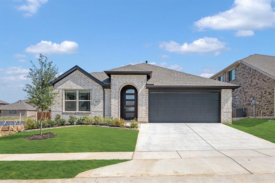 Front exterior of a new home in Eagle Glen Elements, Alvarado, TX, highlighting curb appeal (Image 1).