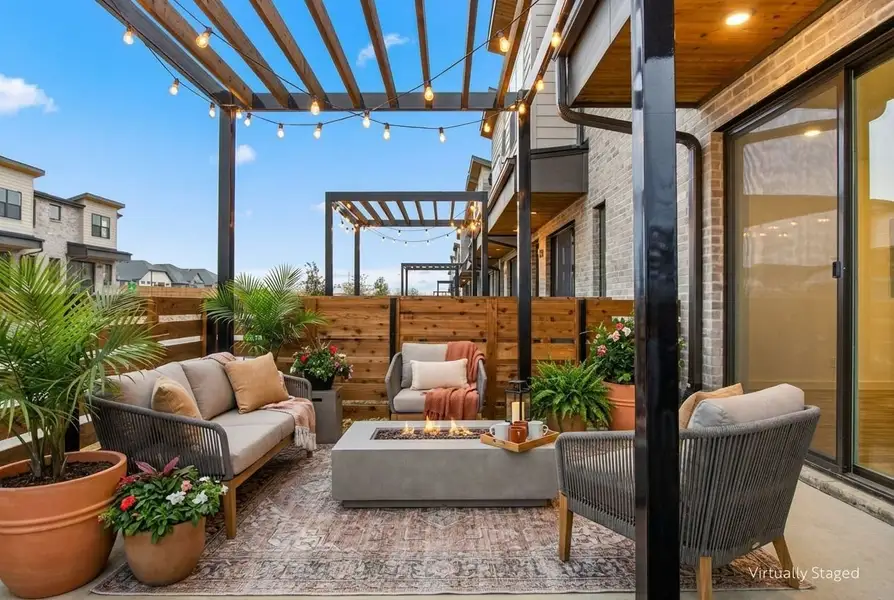 Exterior details and patio area of a home in Willow Grove Townhomes, Melissa (Image 3).