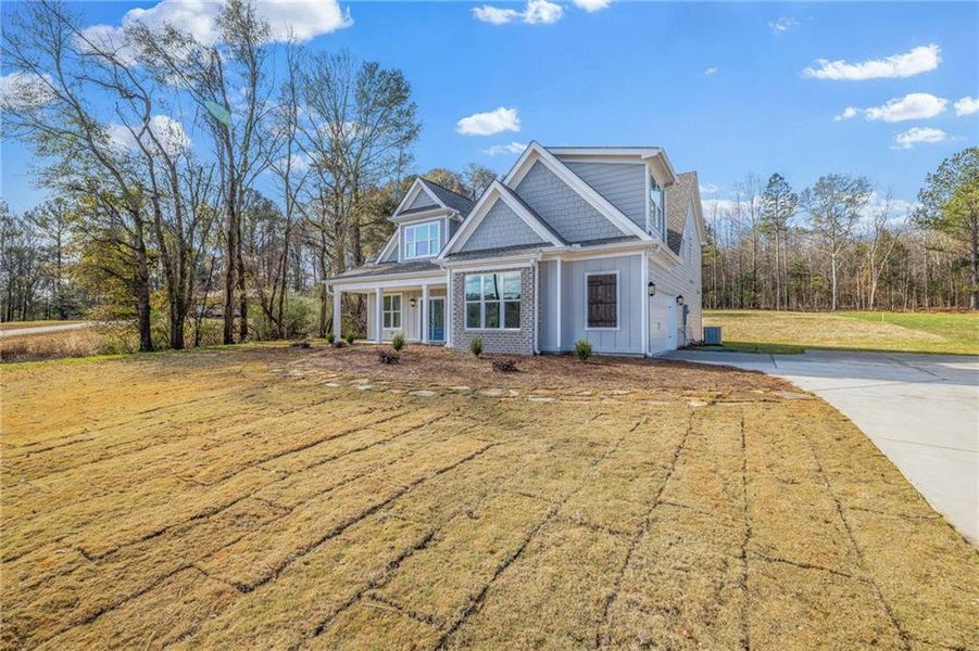 Front exterior of a new home in , Jefferson, GA, highlighting curb appeal (Image 24).