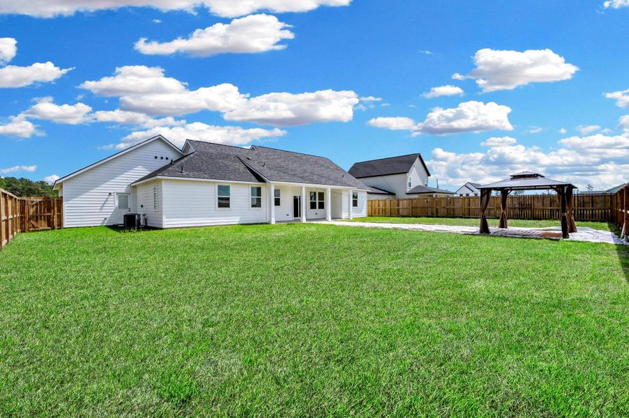 Exterior details and patio area of a home in Spring Branch Crossing, Conroe (Image 23).