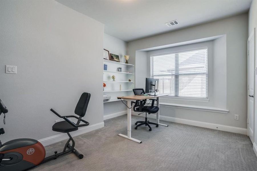 View of carpeted home office