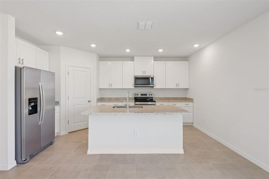 Furnished interior view inside a new home in Hilltop Vistas, Dade City (Image 4).