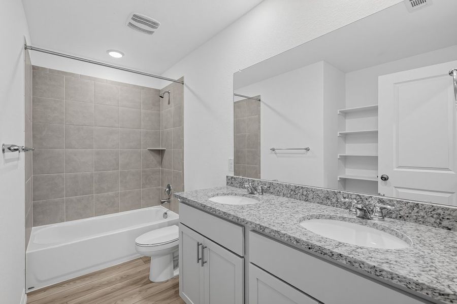 Representative furnished interior of a home built from the Warbler by Taylor Morrison in Longview, Del Valle (Image 7).
