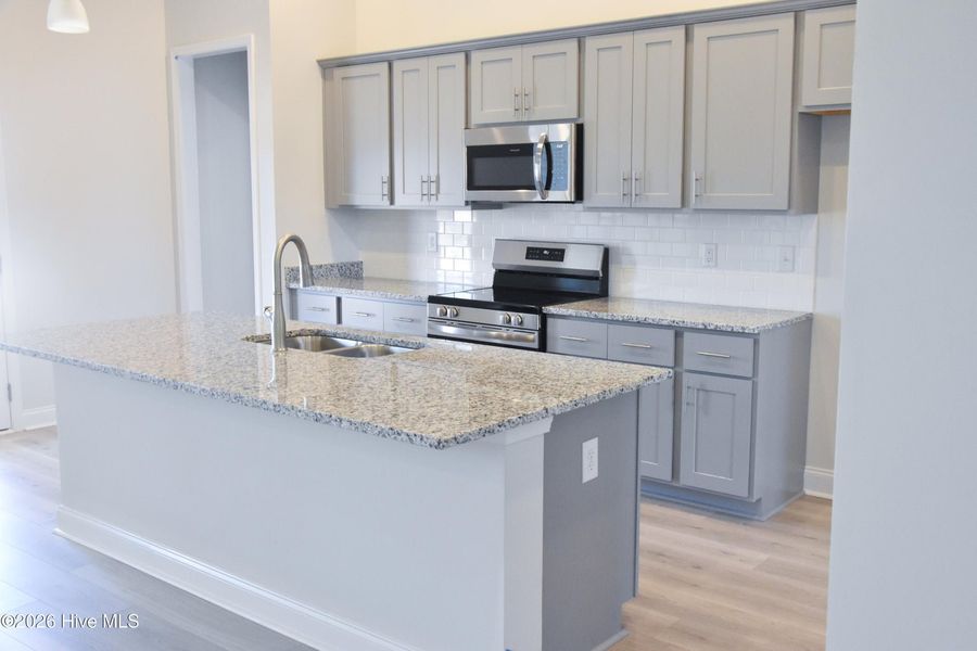 Furnished interior view inside a new home in Windfield, Grimesland (Image 4).