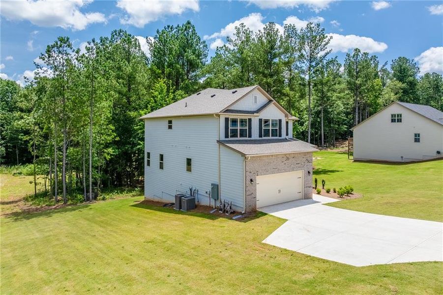 Front exterior of a new home in , Maysville, GA, highlighting curb appeal (Image 21).