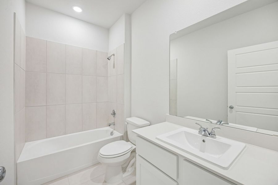 Bathroom in the Stanley II home plan by Trophy Signature Homes – REPRESENTATIVE PHOTO