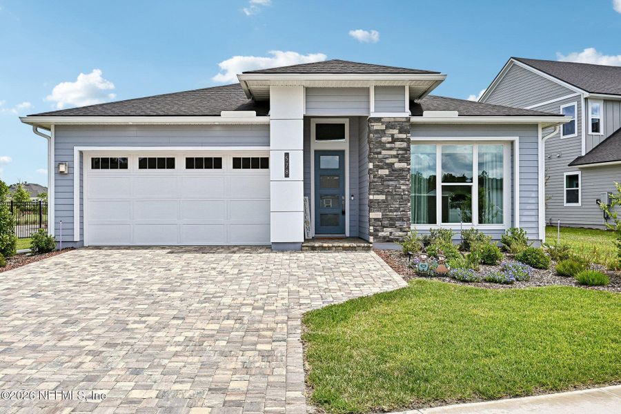 Front exterior of a new home in SilverLeaf, St. Augustine, FL, highlighting curb appeal (Image 28). Front exterior of a new home in SilverLeaf, St. Augustine, FL, highlighting curb appeal (Image 28).