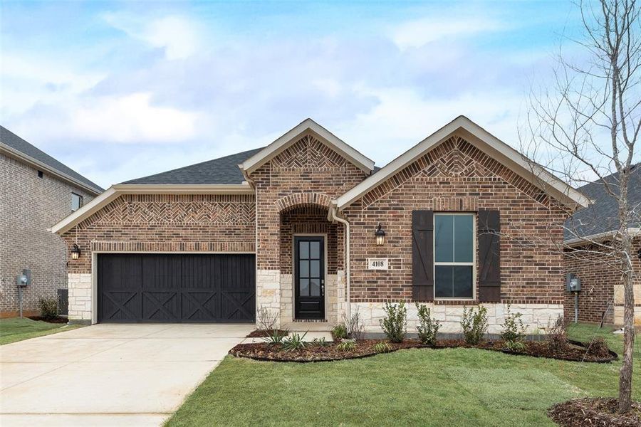 Front exterior of a new home in Spiritas Ranch, Little Elm, TX, highlighting curb appeal (Image 19).