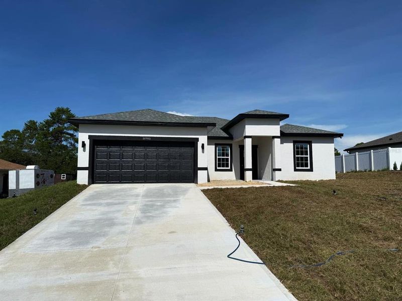 Front exterior of a new home in , Ocala, FL, highlighting curb appeal (Image 2). Front exterior of a new home in , Ocala, FL, highlighting curb appeal (Image 2).