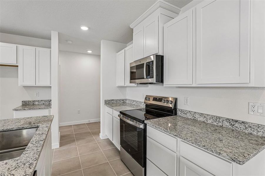 Furnished interior view inside a new home in Cyrene at Harmony, St. Cloud (Image 9).