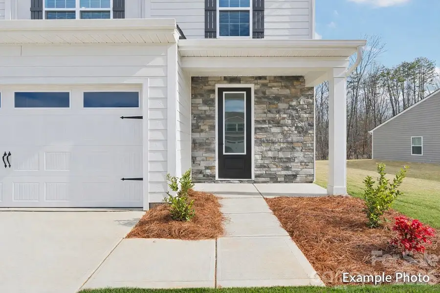 Exterior details and patio area of a home in Colonial Crossing, Troutman (Image 3).