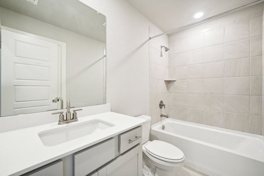 Guest bathroom in the Preston floorplan at a Meritage Homes community.