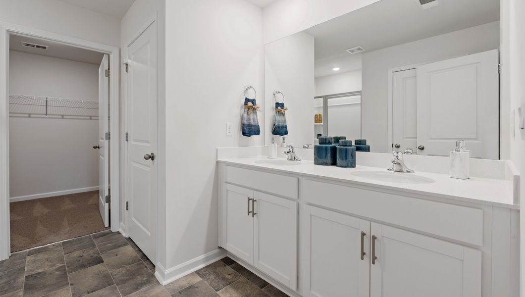Furnished interior view inside a new home in Bentley Park, Greenwood (Image 31).