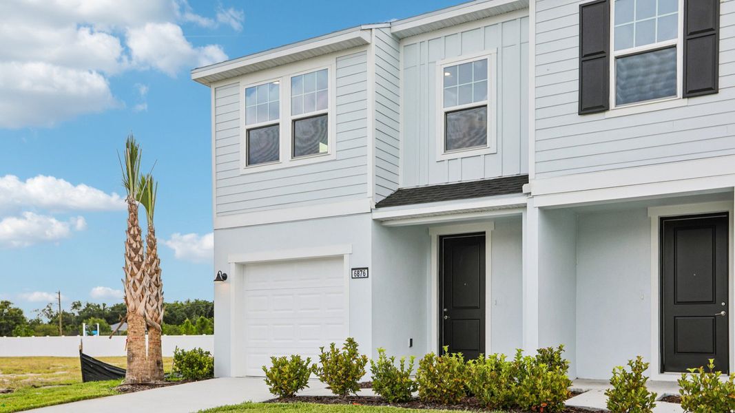 Front exterior of a new home in Twin Oaks, Zephyrhills, FL, highlighting curb appeal (Image 23).