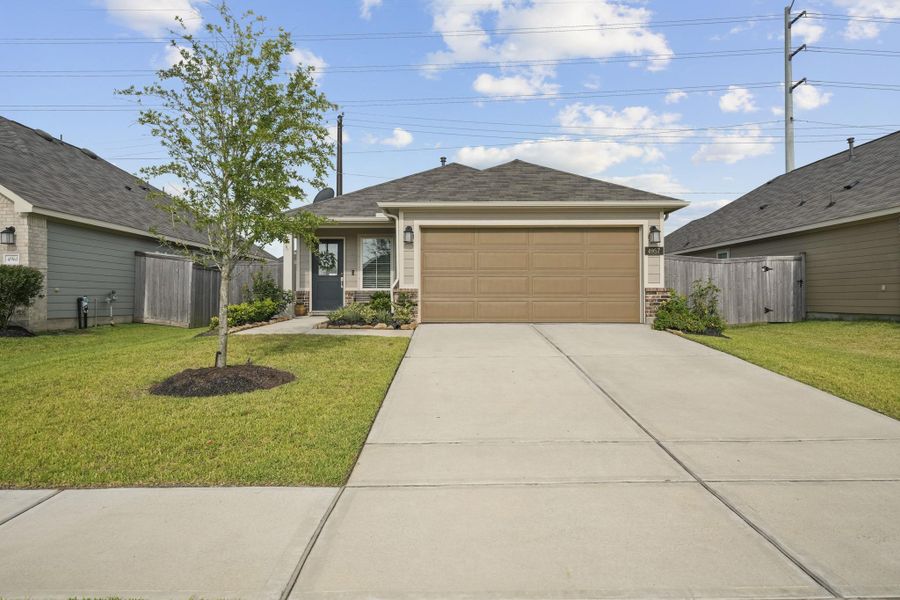 Front exterior of a new home in Ambrose, La Marque, TX, highlighting curb appeal (Image 1). Front exterior of a new home in Ambrose, La Marque, TX, highlighting curb appeal (Image 1).