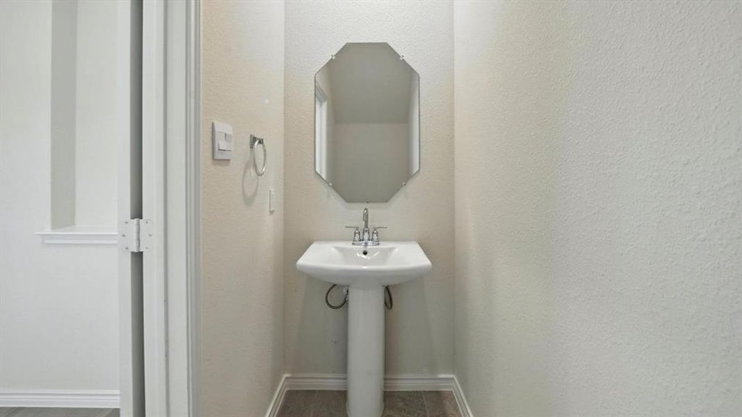 Bathroom featuring baseboards