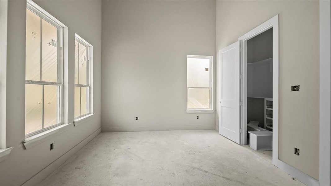 Front bedroom with high ceilings.