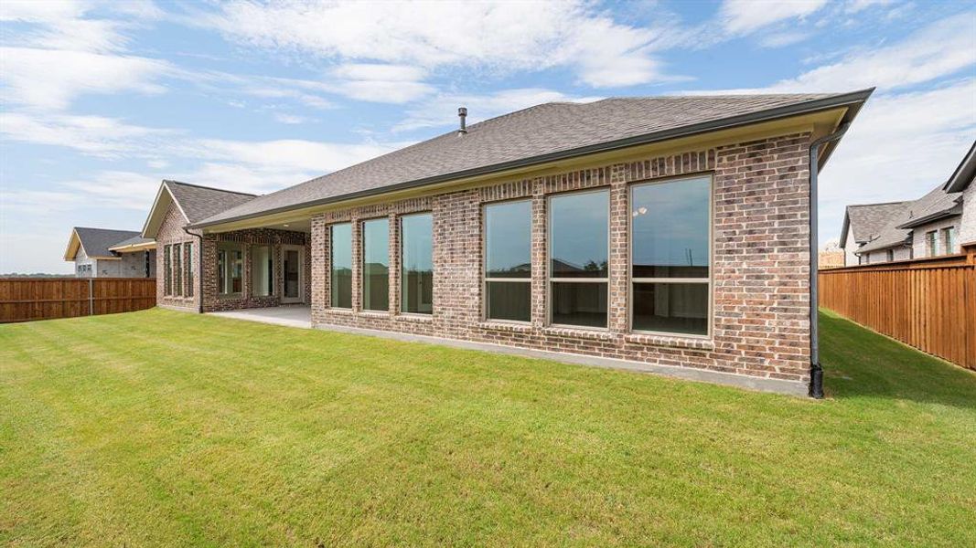 Front exterior of a new home in Terraces 72', Rockwall, TX, highlighting curb appeal (Image 2). Front exterior of a new home in Terraces 72', Rockwall, TX, highlighting curb appeal (Image 2).