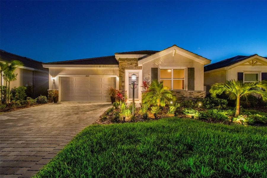 Front exterior of a new home in Star Farms at Lakewood Ranch, Bradenton, FL, highlighting curb appeal (Image 23).