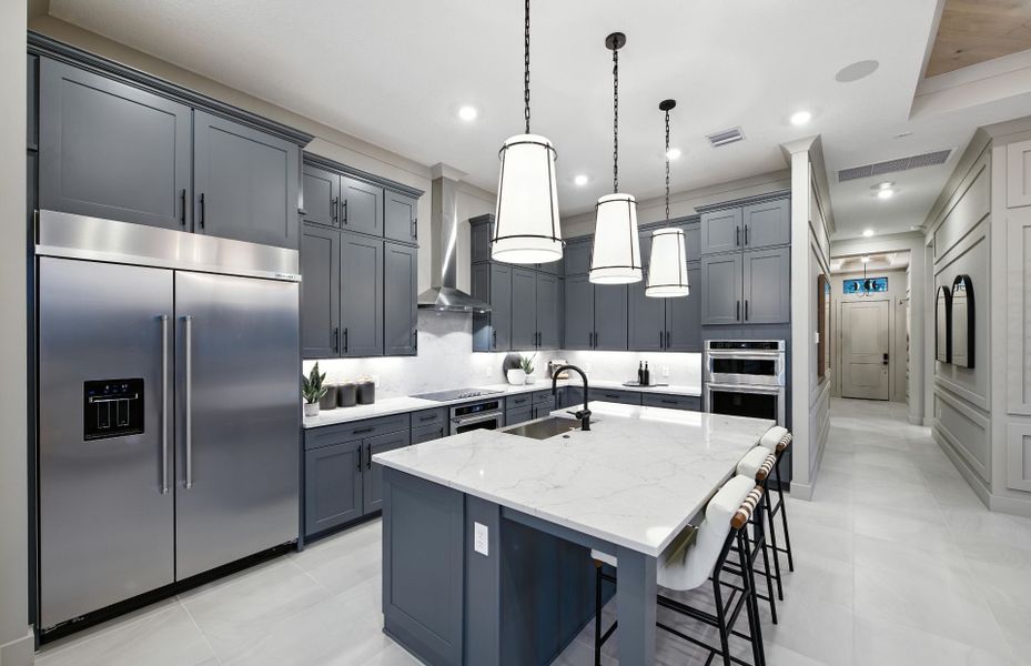 Representative furnished interior of a home built from the Brixton by DiVosta in The Reserve at Eastpointe, Palm Beach Gardens (Image 9).