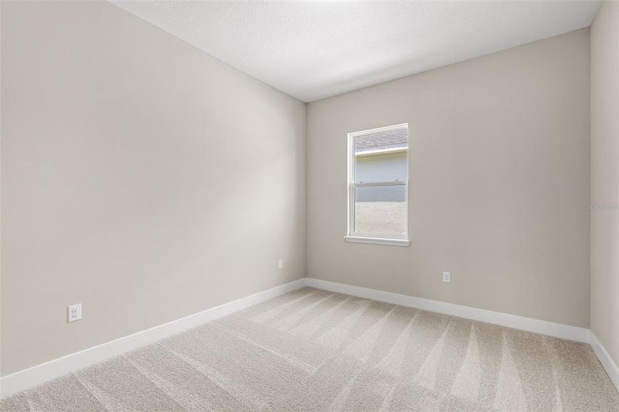 Spacious, unfurnished interior of a new home in Gray Hawk at Hole Two, Daytona Beach (Image 21).