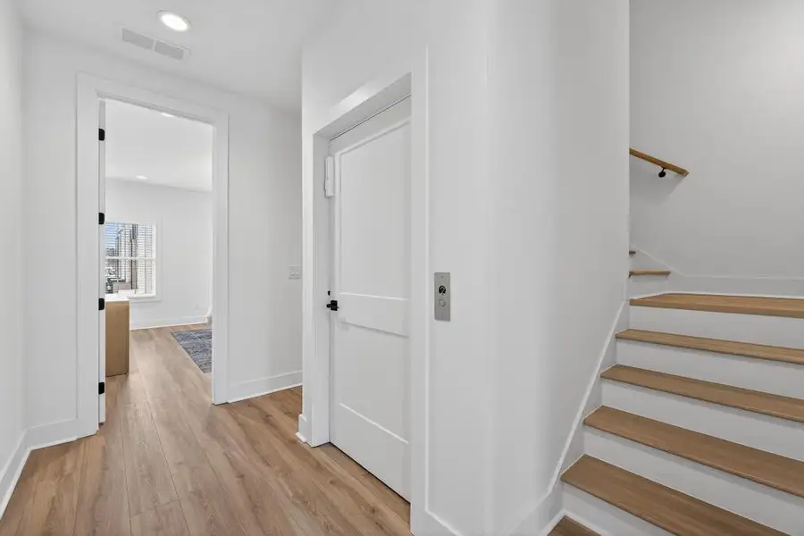 Spacious, unfurnished interior of a new home in Skyview On Broad, Sugar Hill (Image 25). Spacious, unfurnished interior of a new home in Skyview On Broad, Sugar Hill (Image 25).