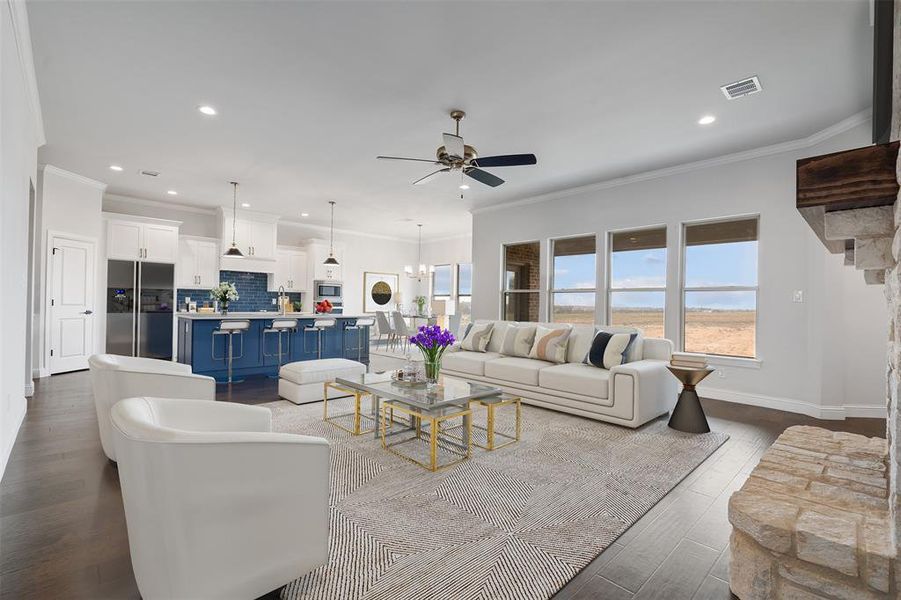 Living room featuring crown molding, dark hardwood / wood-style floors, and ceiling fan with notable chandelier