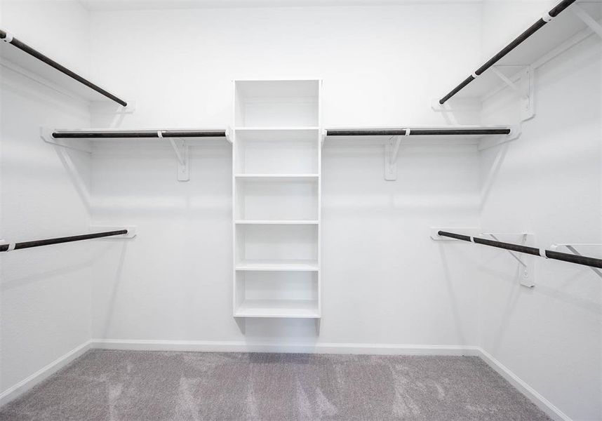 An expansive walk-in closet in the primary suite offers ample space to keep your wardrobe organized and accessible.