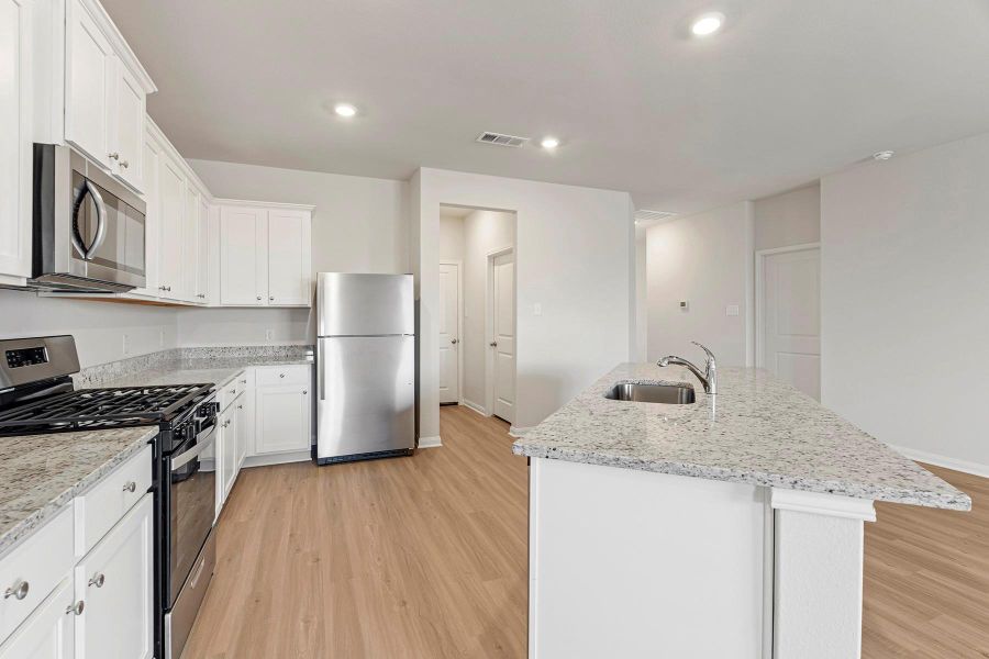 Furnished interior view inside a new home in Canterra Creek, Iowa Colony (Image 2).