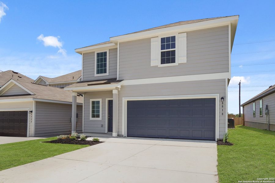 Front exterior of a new home in Hickory Ridge, Elmendorf, TX, highlighting curb appeal (Image 16).