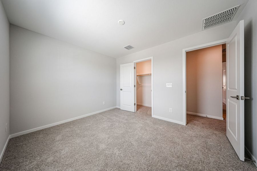 A hallway with white doors.