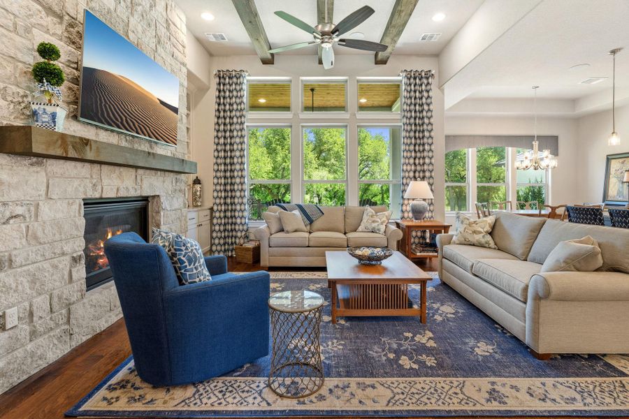 Exposed ceiling beams add warmth and architectural character to the open-concept living space. Exposed ceiling beams add warmth and architectural character to the open-concept living space.