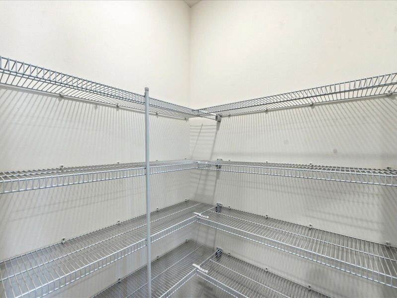 Spacious, unfurnished interior of a new home in The Coves at Lakes of Cane Bay II, Summerville (Image 25).