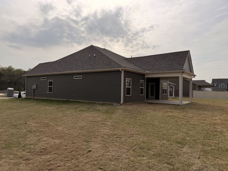 Showcasing the premium corner lot this home sits on w/ it`s extended covered back porch!