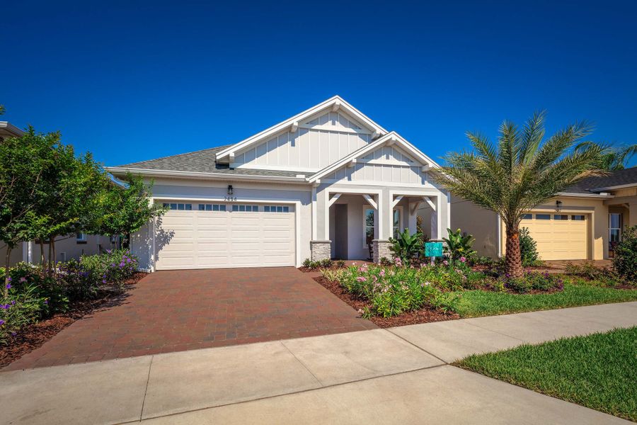 Front exterior of a new home in Twin Lakes, St. Cloud, FL, highlighting curb appeal (Image 2).