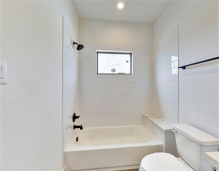 Secondary bath.Photos of similar completed home by same builder. Selections may differ.