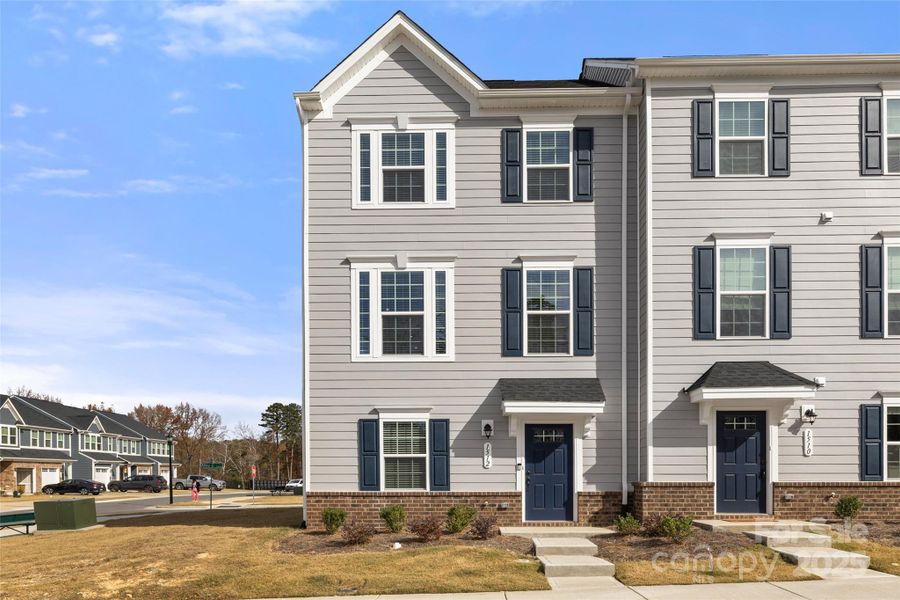 Front exterior of a new home in , Matthews, NC, highlighting curb appeal (Image 1). Front exterior of a new home in , Matthews, NC, highlighting curb appeal (Image 1).