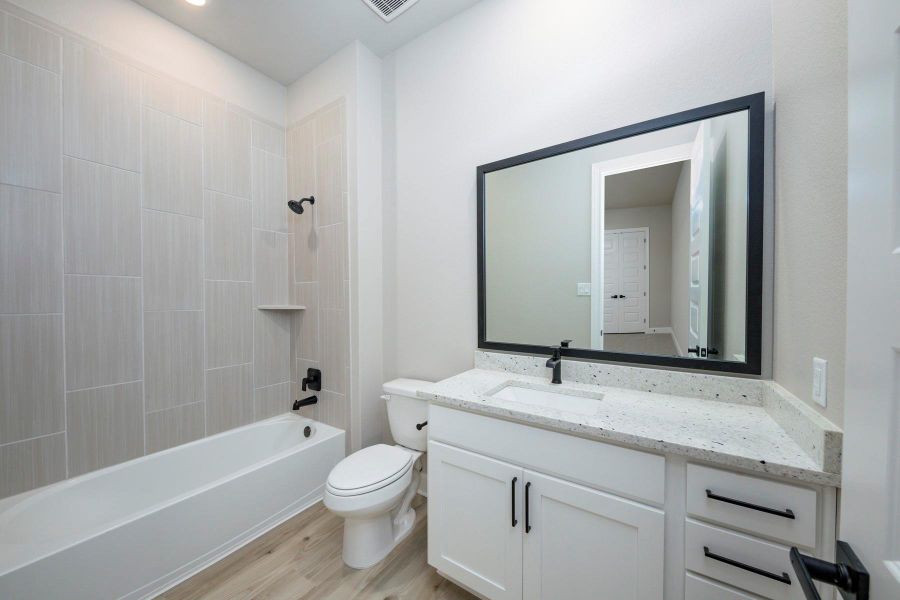 Furnished interior view inside a new home in Sierra Vista, Iowa Colony (Image 9).