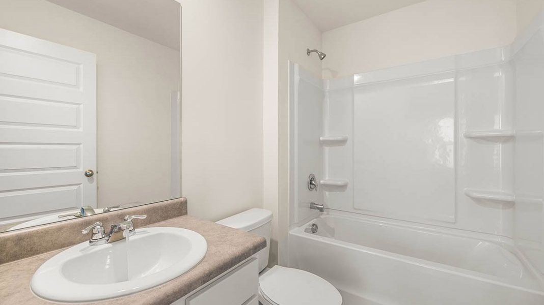 Representative furnished interior of a home built from the Dennis by D.R. Horton in Glenmaye, Hampton (Image 12).