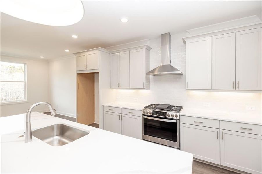 Tile backsplash in kitchen - Pictures represent a previously built home, not the actual home.