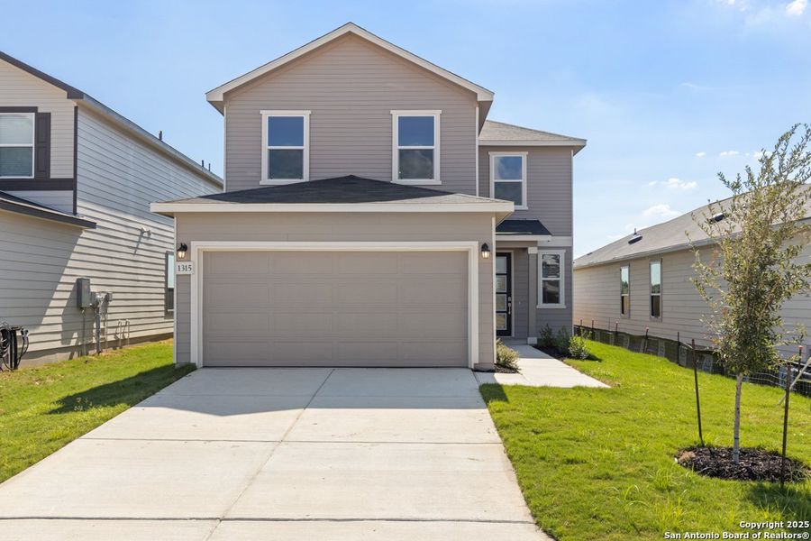 Front exterior of a new home in Legend Heights, New Braunfels, TX, highlighting curb appeal (Image 1). Front exterior of a new home in Legend Heights, New Braunfels, TX, highlighting curb appeal (Image 1).